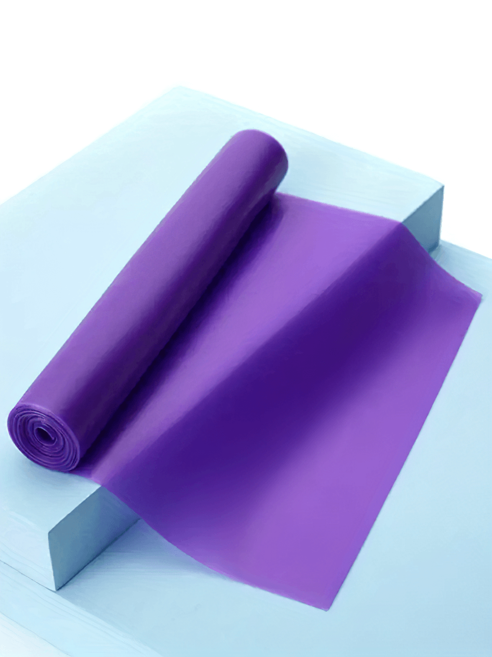 Purple latex resistance band for yoga and Pilates, ideal for home workouts, physical therapy, and enhancing mobility and strength.