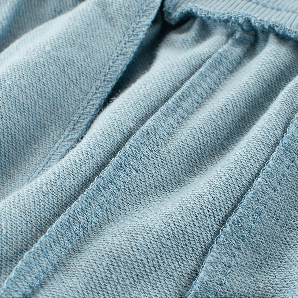 Close-up of blue stitch detailing on cotton shorts with soft elastic waistband for the Leaf Print Shorts with Elastic Waist and Pockets - SF3790.
