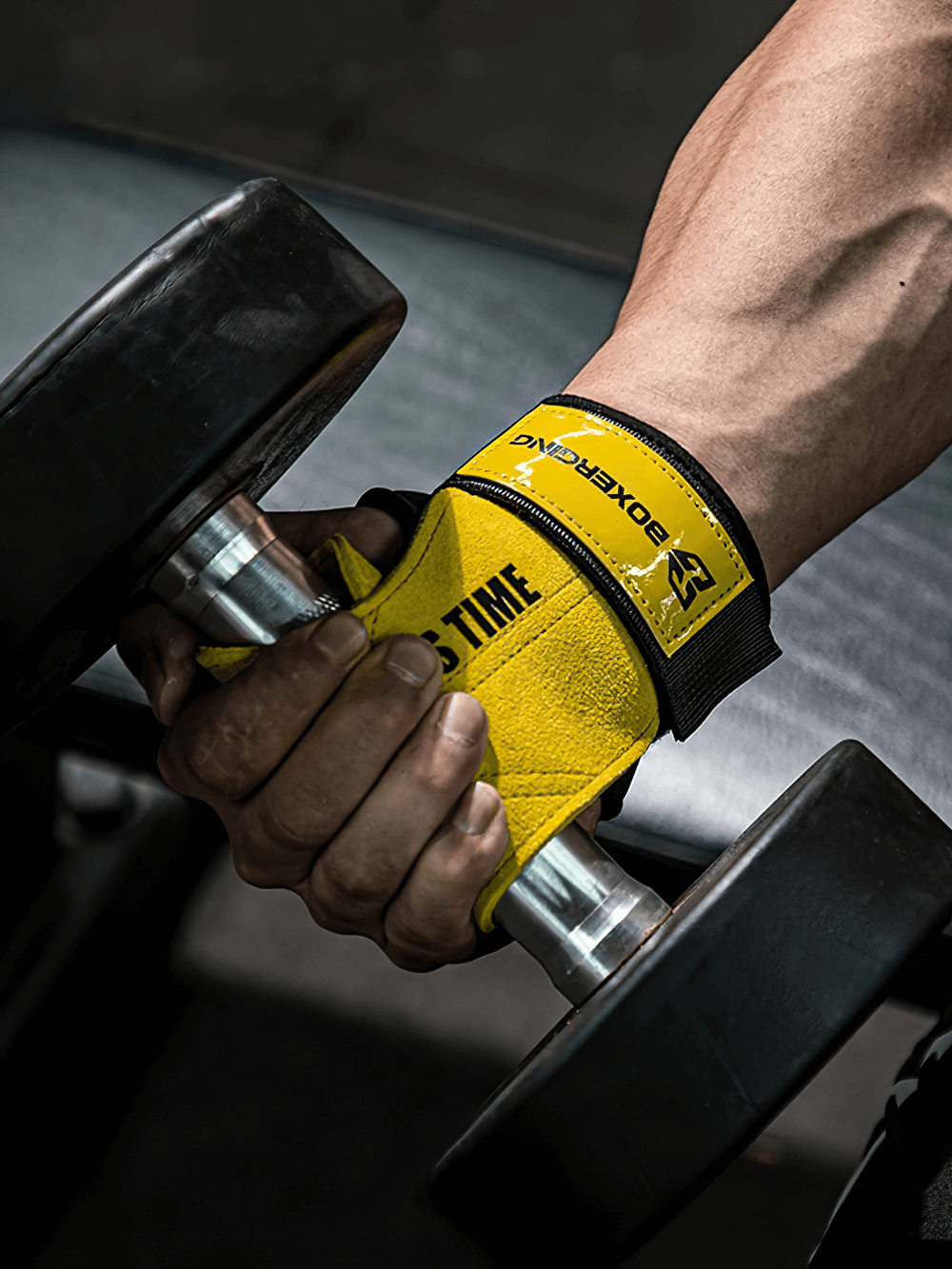 Close-up of hand lifting a dumbbell with Leather Gym Grips with Wrist Straps for Powerlifting - SF3516, showcasing secure fit.