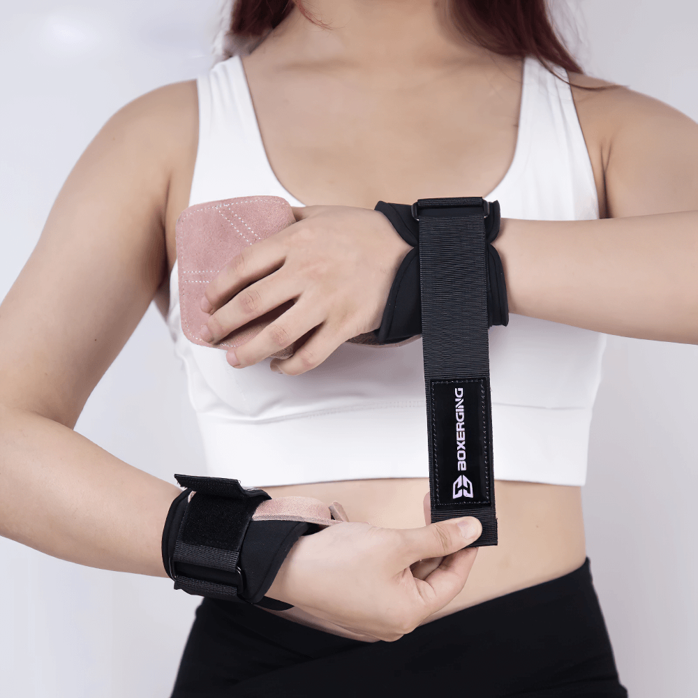 Person wearing Leather Gym Grips with Wrist Straps for Powerlifting - SF3516, showcasing adjustable straps and non-slip padding.