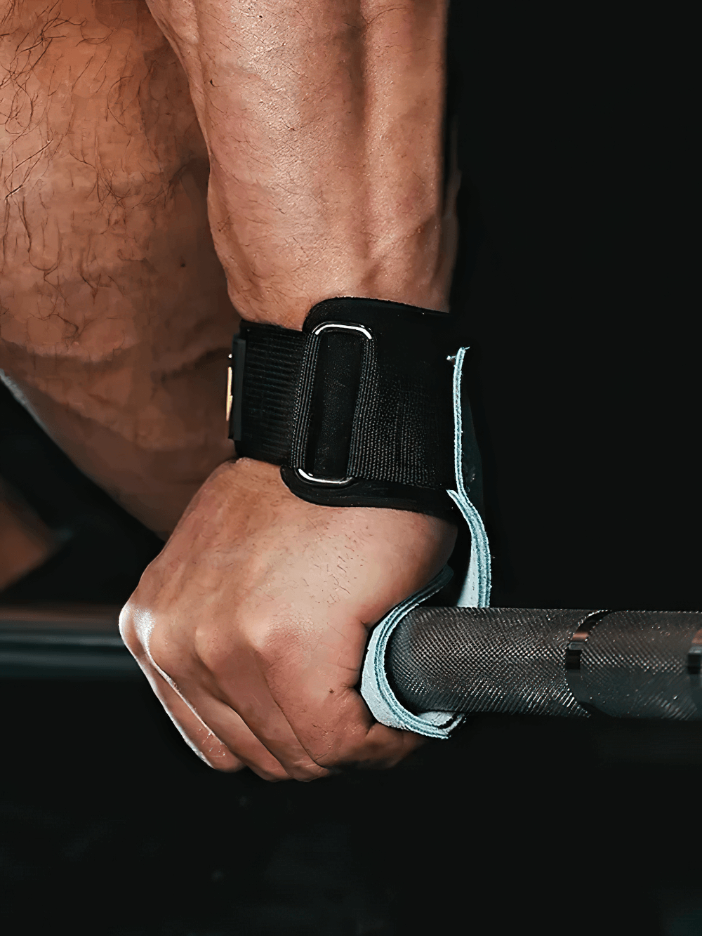 Close-up of a hand using Leather Gym Hand Grips with Wrist Support Straps - SF3519 during weightlifting for a secure hold.
