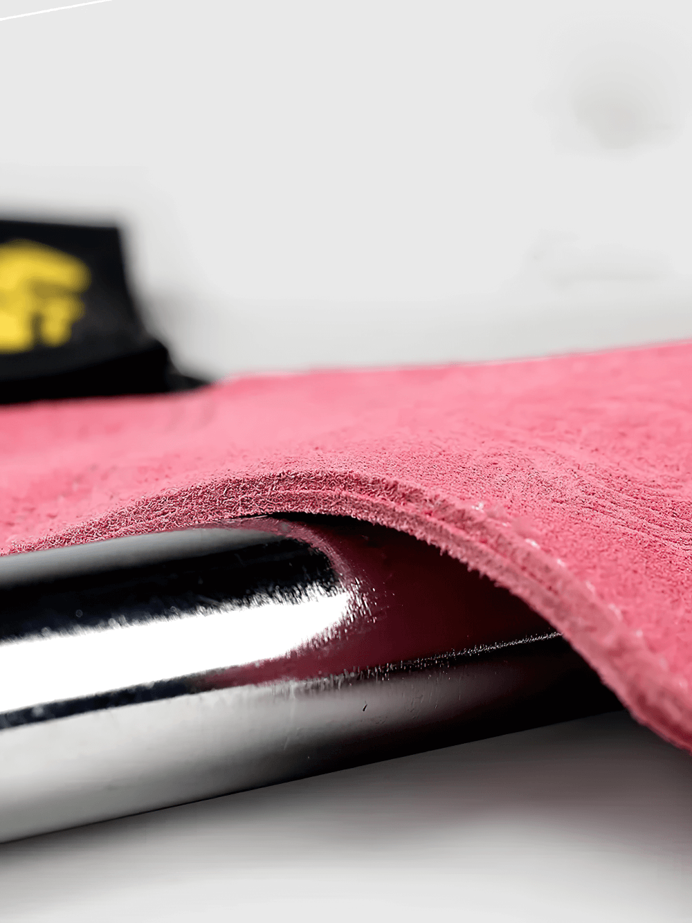 Close-up of Leather Gym Hand Grips with Wrist Support Straps - SF3519 showing pink suede leather texture and a metal bar