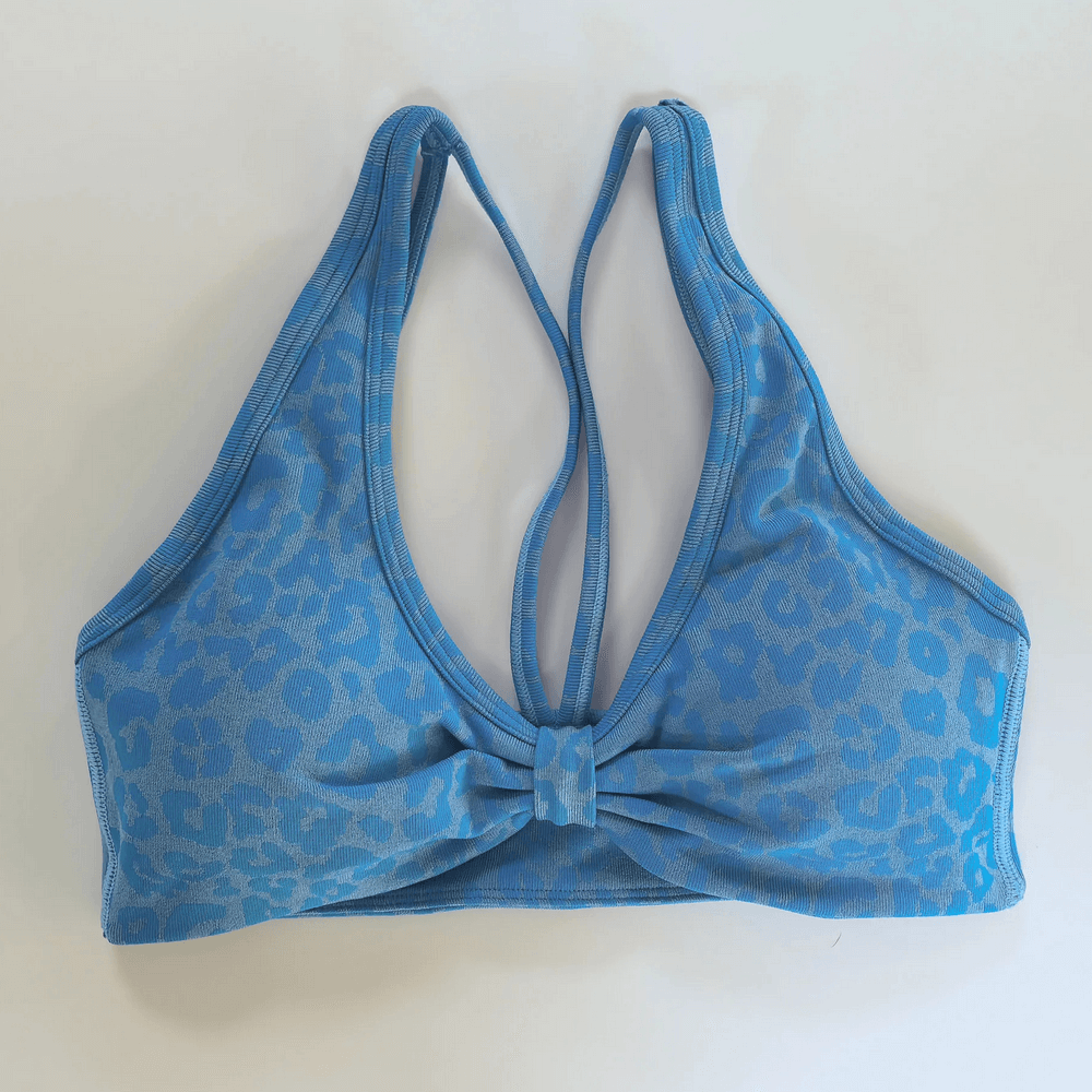 Leopard Print Deep V Yoga Bra with Back Straps - SF4077, featuring a stylish front bow and adjustable back for yoga and casual wear.