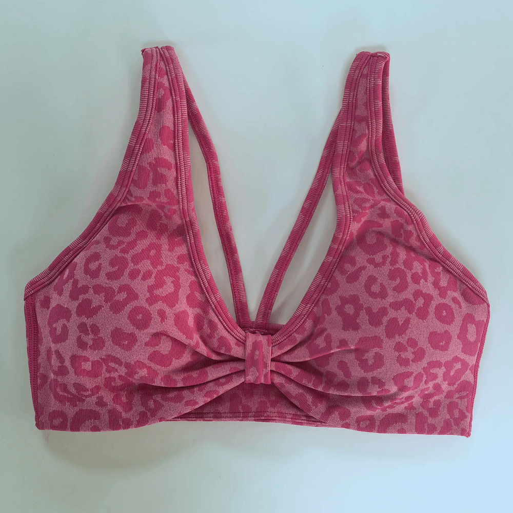 Leopard Print Deep V Yoga Bra with Back Straps - SF4077 in pink with a front bow and adjustable straps.