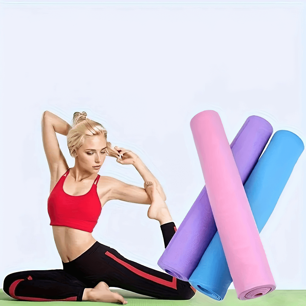 Woman practicing yoga on lightweight anti-slip EVA mat, showcasing flexibility with pink, purple, and blue mats rolled up nearby.
