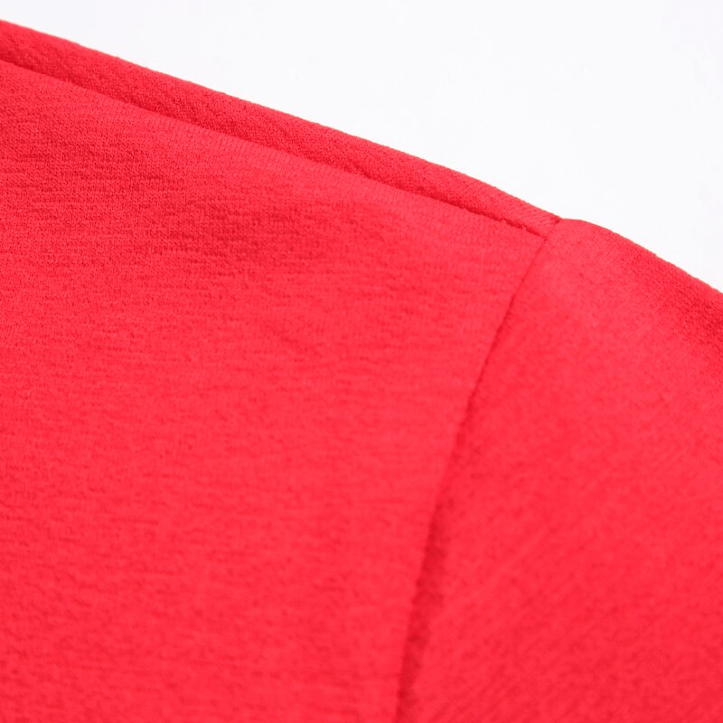 Close-up of lightweight elastic red sports T-shirt fabric showcasing the solid color and smooth texture.