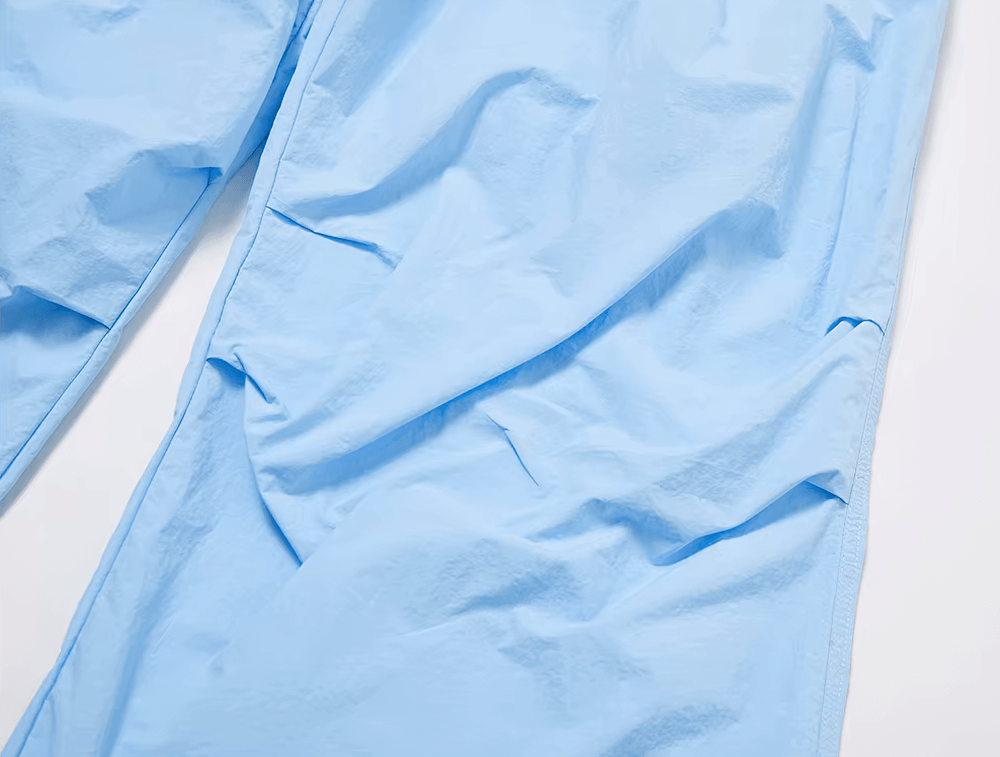 Close-up of light blue lightweight women's pants with elastic waist, perfect for yoga, fitness, or casual wear.