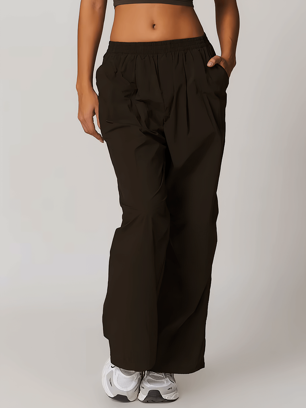 Lightweight high-waist women's yoga pants with pockets, elastic waist, and drawstring. Perfect for fitness and outdoor activities.