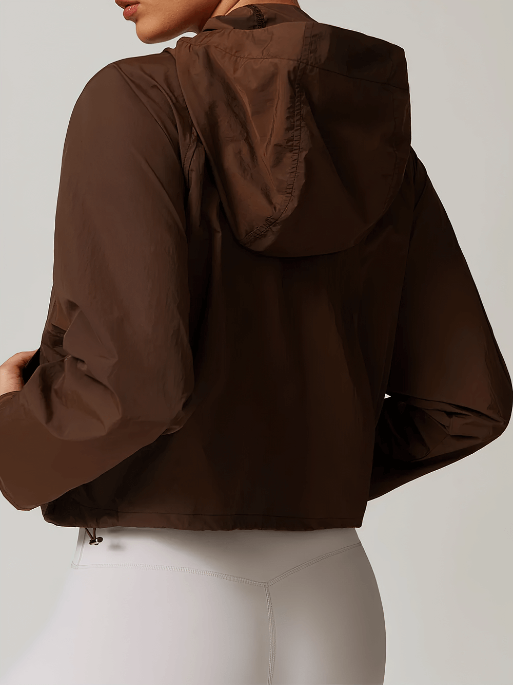 Activewear brown windbreaker with hood, lightweight SF2346 jacket for women. Perfect for outdoor activities and casual wear.