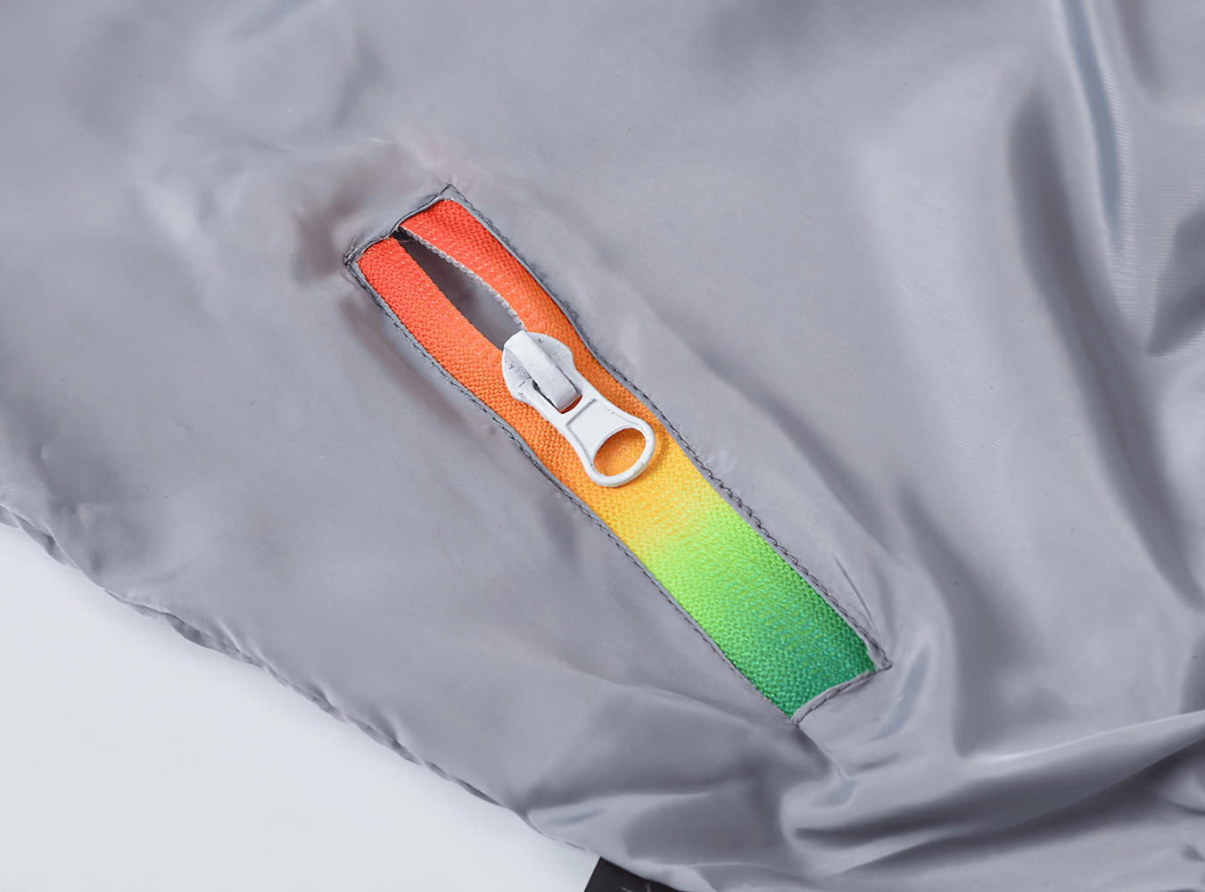 Close-up of Lightweight Hooded Windbreaker with Rainbow Zipper - SF3635 showing vibrant zipper detail on solid color jacket.