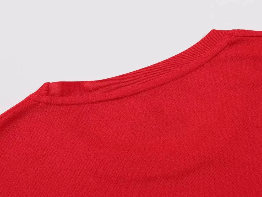 Close-up of a red O-neck collar on a lightweight men's athletic T-shirt, showcasing breathable polyester fabric for running and gym workouts.