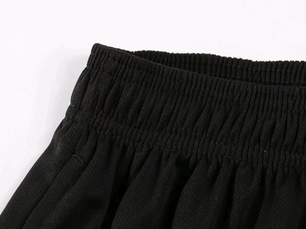 Close-up of black elastic waistband on men's athletic shorts SF2025, perfect for running and gym workouts.