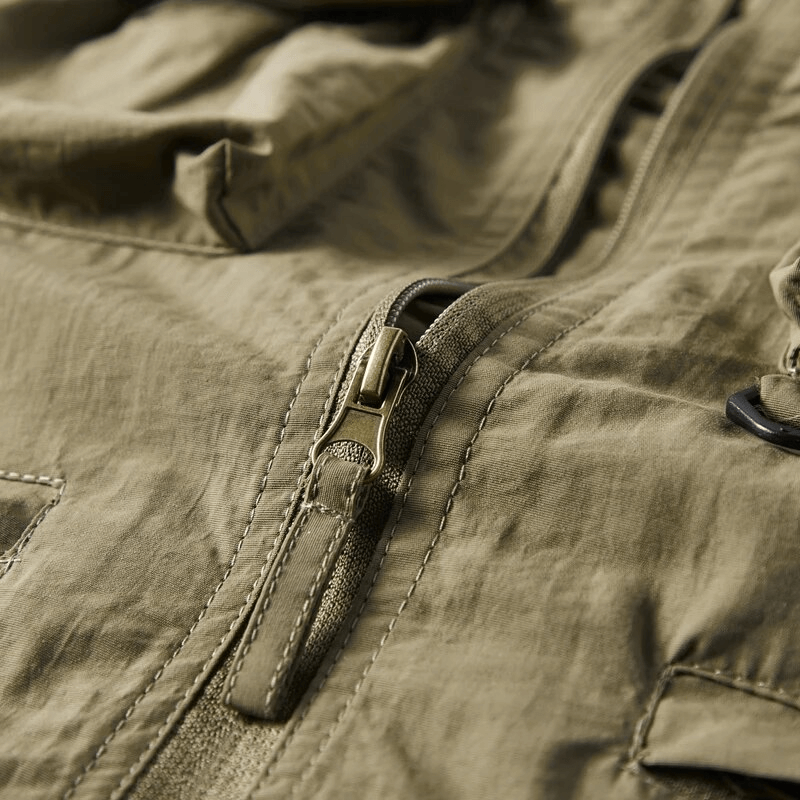 Close-up of zipper detail on lightweight men's vest with hood SF1786, showcasing polyester material and casual style.
