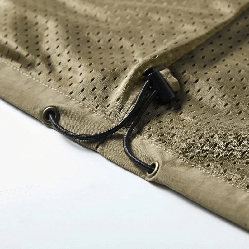 Close-up of lightweight men's vest drawstring hem detail, showcasing breathable polyester fabric and sturdy construction for outdoor wear.