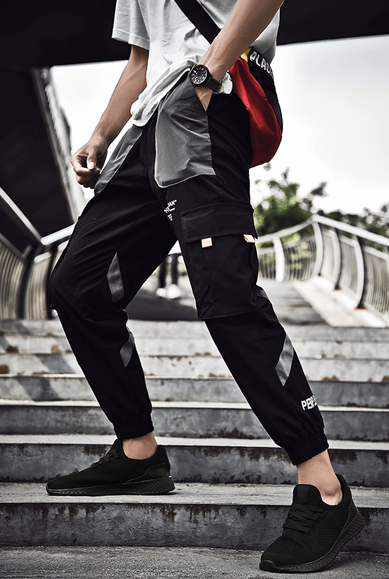Man wearing Lightweight Mesh Tenis Shoes on stairs, showcasing flexibility and comfort for outdoor training.