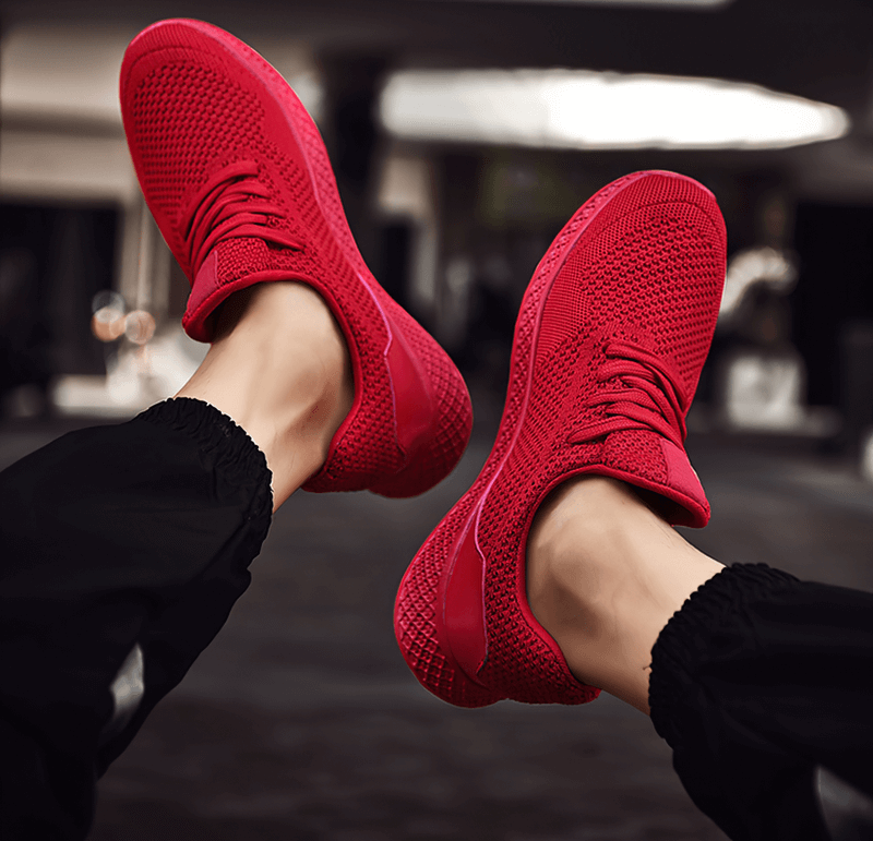 Red lightweight mesh men's outdoor training shoes with rubber outsole, perfect for trail running and enhancing movement freedom.