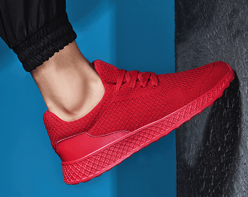 Men's lightweight mesh tennis shoes in red for outdoor training with superior cushioning, flexibility, and traction.