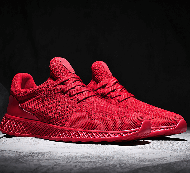 Red men's outdoor training shoes with lightweight mesh and EVA cushioning for superior traction and breathability.