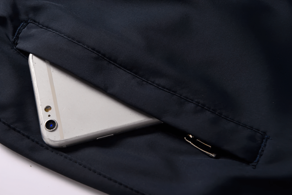 Close-up of phone in jacket pocket of lightweight windproof waterproof sports jacket - SF2284.