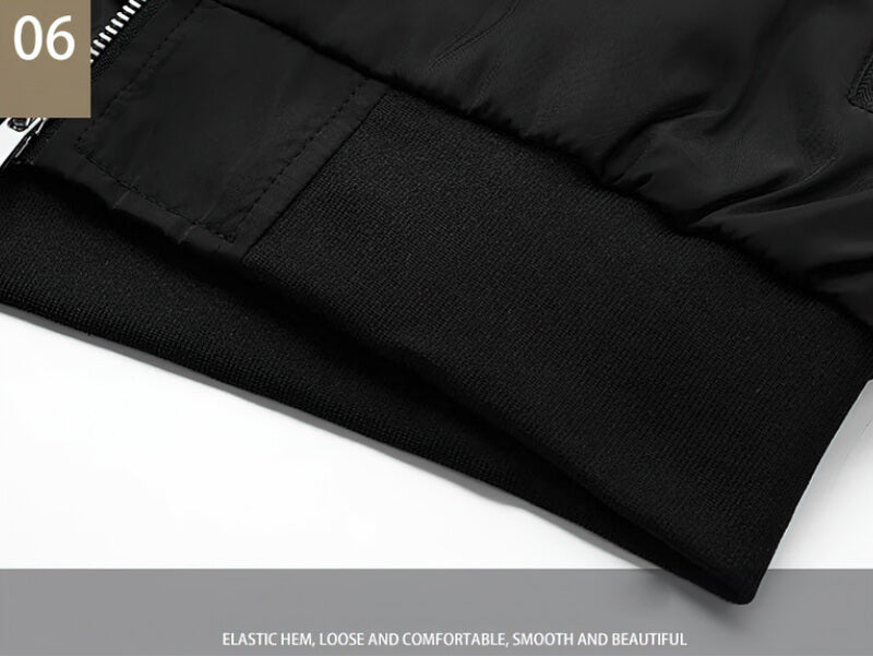 Close-up of black running bomber jacket's elastic hem, showcasing smooth and comfortable design.