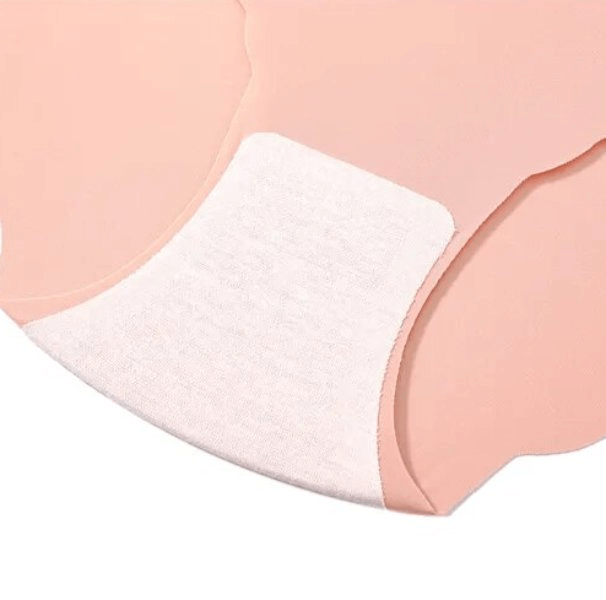 Close-up of lightweight seamless low waist panties in peach with soft white lining. Ideal for comfortable, everyday wear.