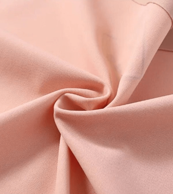 Close-up of pink lightweight seamless low-waist panties fabric, showcasing breathable polyester and nylon blend for comfort.