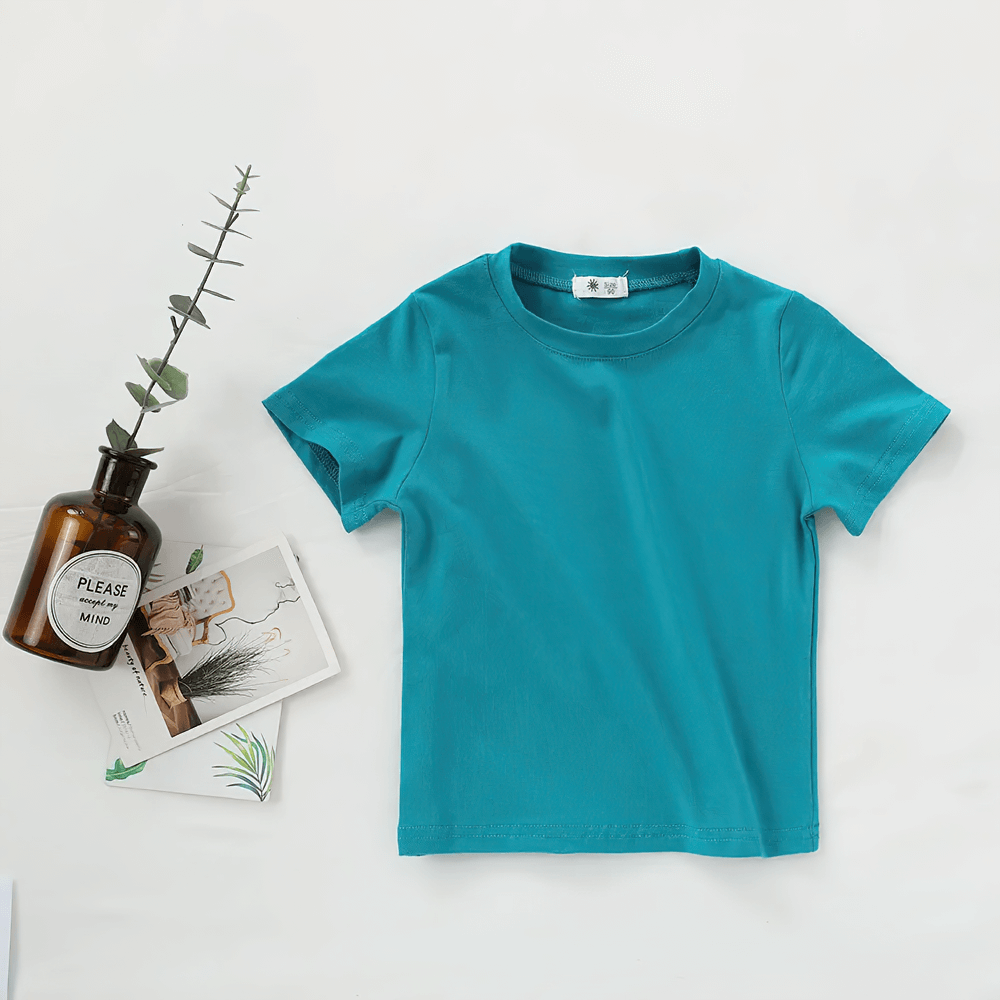 Lightweight Solid Color Short-Sleeve Cotton Tee - SF3851 in teal, perfect for children's summer wear, with plants and postcards.
