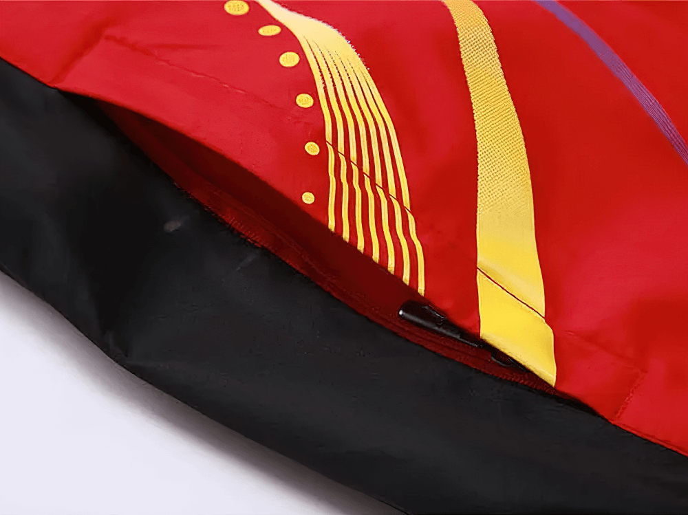 Close-up of Lightweight Tracksuit with Modern Print Design SF2281 in red and black with yellow accents, featuring mesh lining.