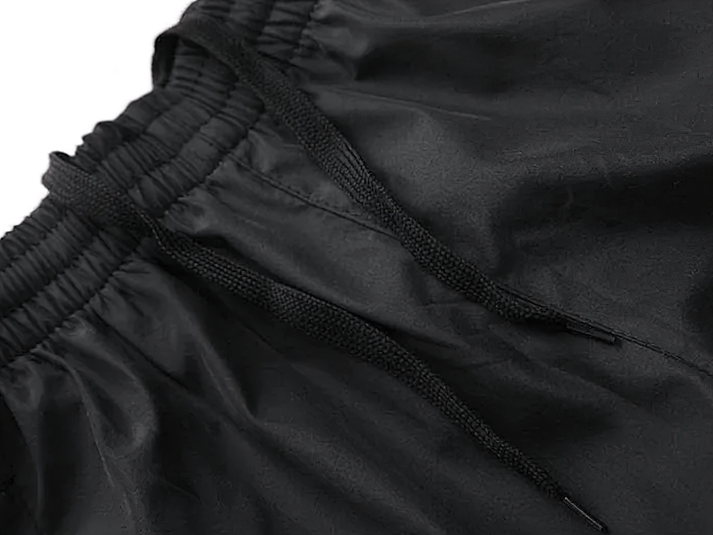 Close-up of black athletic tracksuit pants with adjustable drawstring, part of the Lightweight Tracksuit SF2281.