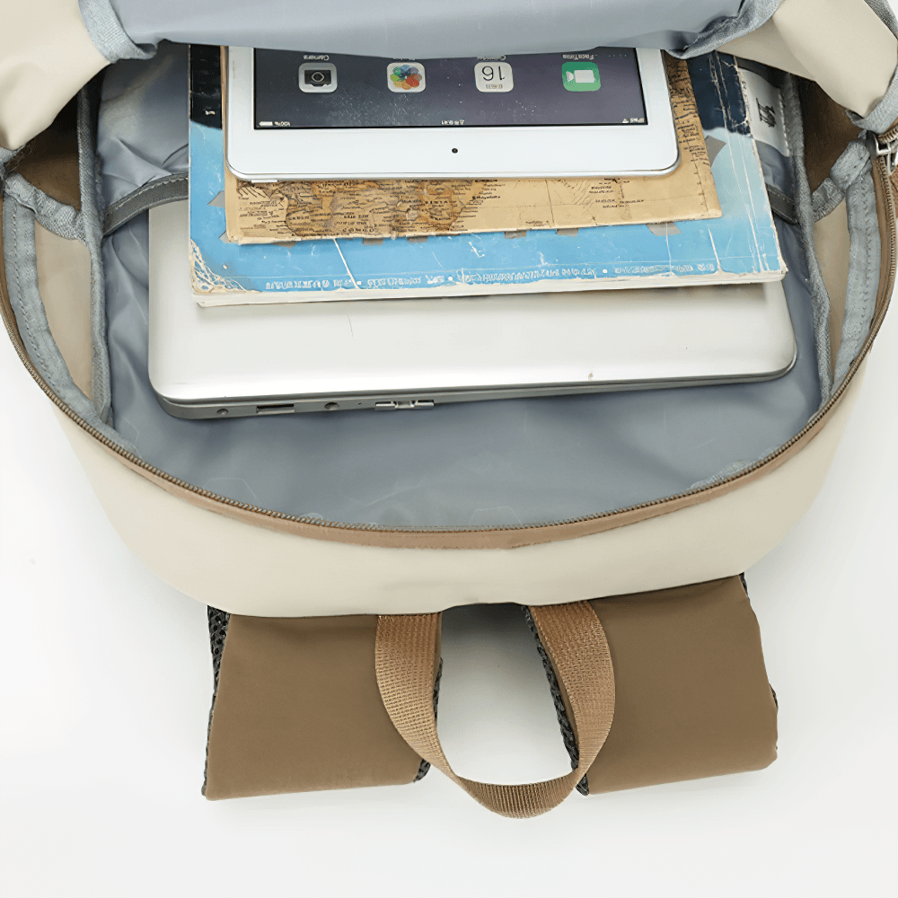 Interior view of lightweight waterproof hiking backpack showing laptop and map storage compartments, perfect for outdoor travel.