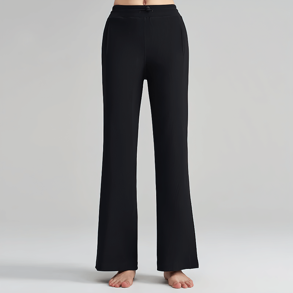 Women's black wide-leg ribbed lounge pants with side pockets, featuring adjustable waistband. Ideal for casual wear or travel. Model SF2387.