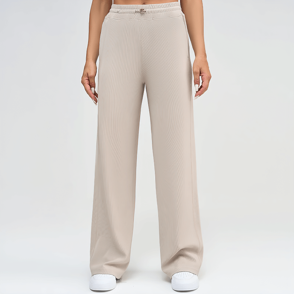 Elegant lightweight wide-leg ribbed lounge pants for women, featuring cozy fabric and functional side pockets, ideal for casual wear.