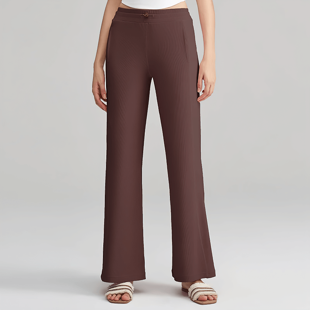 Lightweight wide-leg ribbed lounge pants for women with adjustable waistband, side pockets, and seamless design in brown.