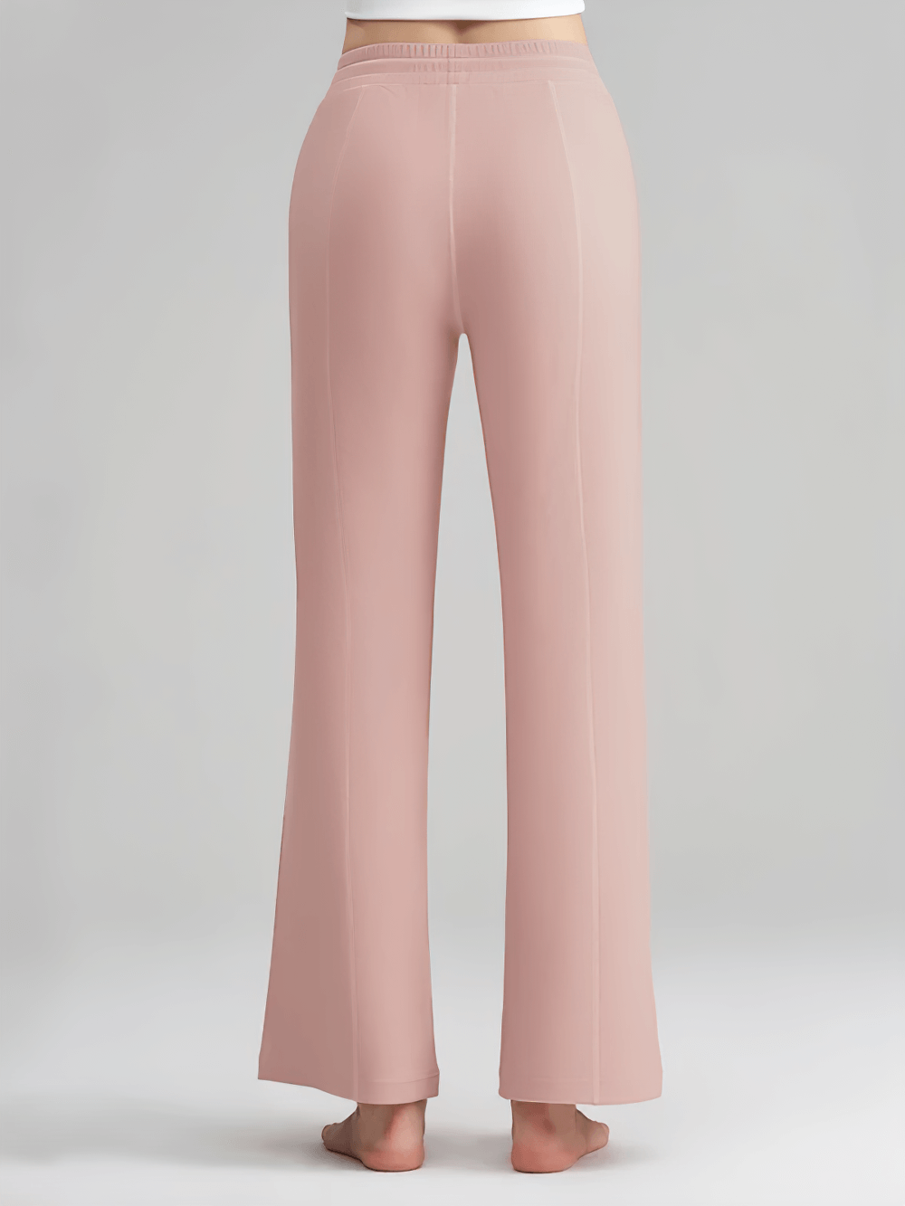 Back view of pink lightweight wide-leg ribbed lounge pants with stretchy waistband and side pockets.