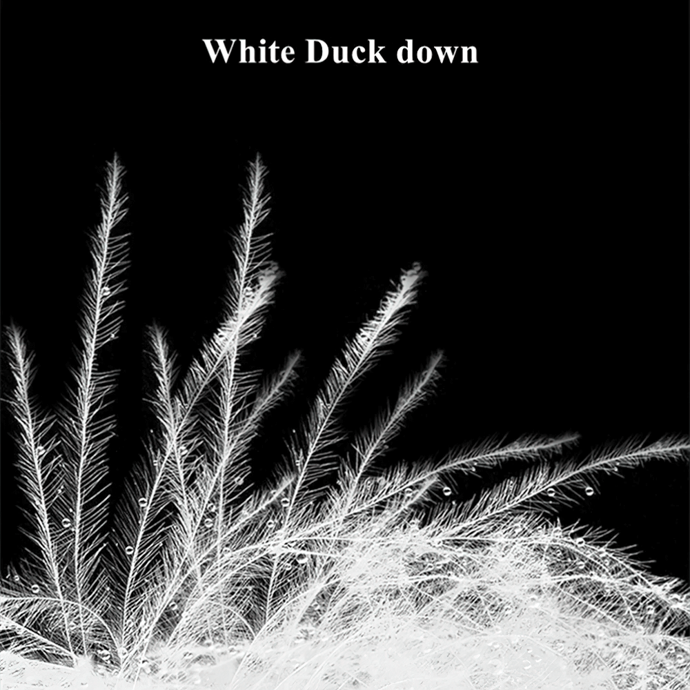 Close-up of white duck down feathers with a black background, illustrating softness and texture.