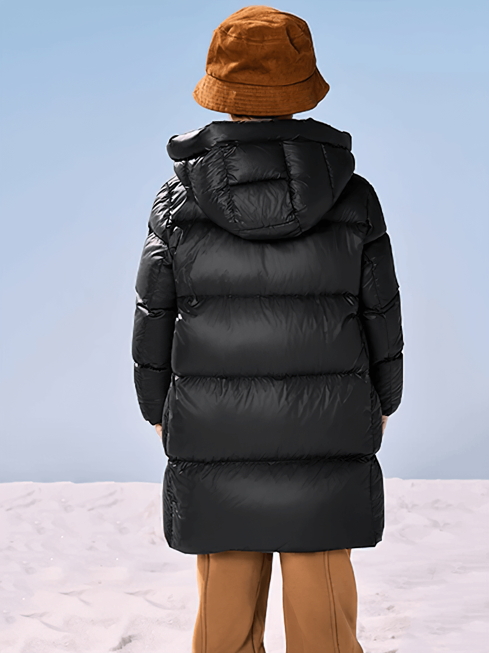 Child wearing Long Down Jacket with Windproof Hood Design - SF3512 in snow, showcasing waterproof and windproof features.