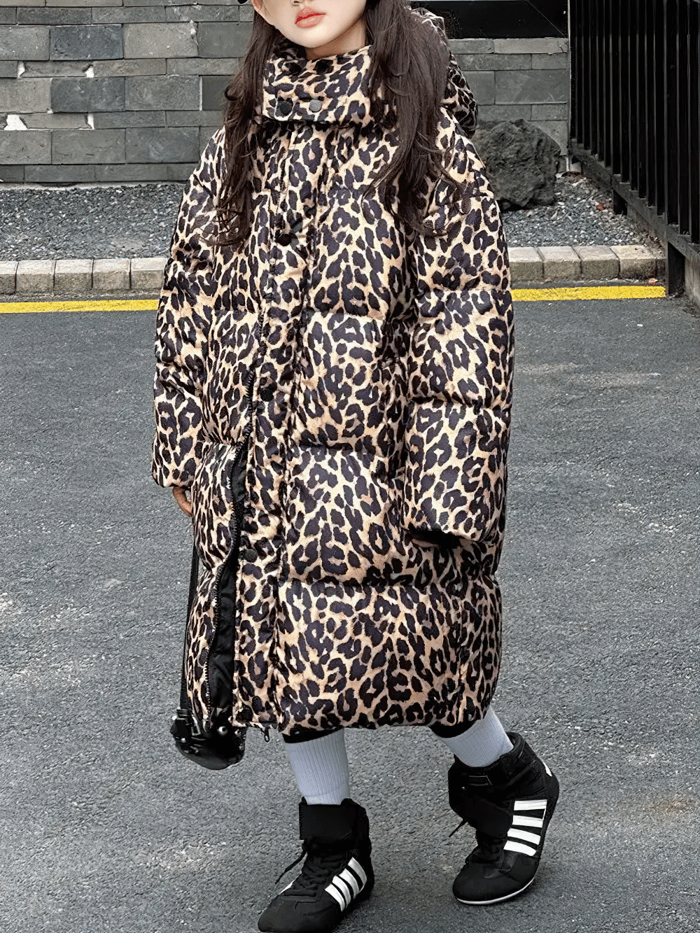 Girl wearing Long Leopard Print Hooded Puffer Coat - SF3527, stylish animal print winter jacket for girls with oversized hood.