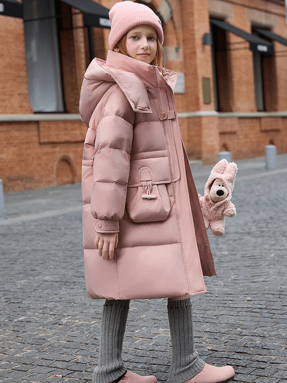 Child in pink Long Puffer Coat with Hood and Utility Pockets - SF3630, stylish winter streetwear with oversized hood and flap pockets.