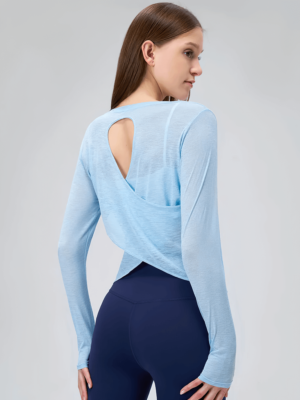 Woman wearing Long Sleeve Quick Dry Yoga Top for Women - SF4183 with backless design and blue color, perfect for fitness and yoga.