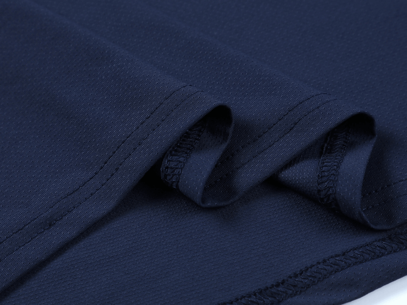 Close-up of the fabric detail of the Long Sleeve Running Shirt with Sport Panels - SF4638, showcasing its elastic design.