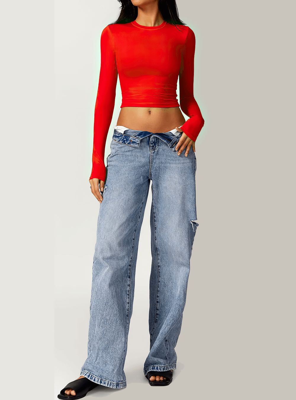 Red long sleeve crop top paired with casual jeans and slides, perfect for yoga and fitness style.