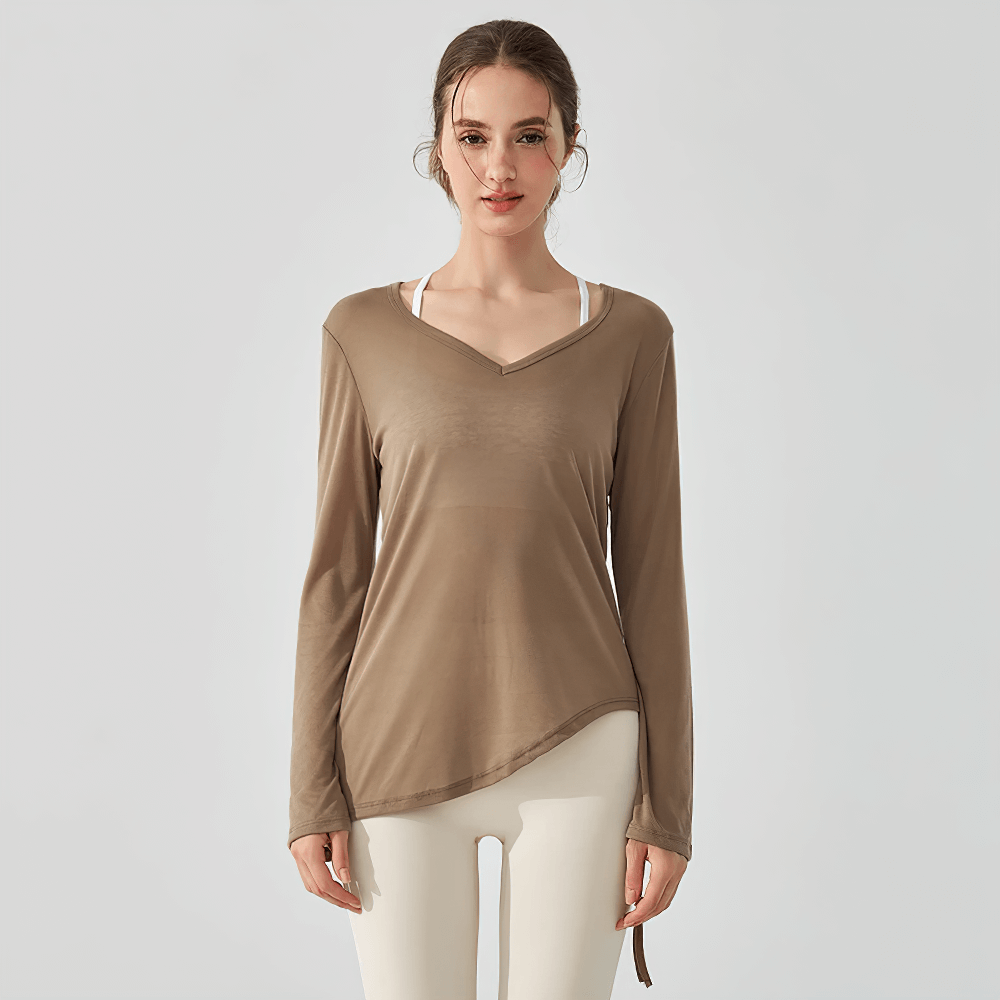 Model wearing Long-Sleeve Yoga Top SF2316 with V-neck and ruched side-tie detail, perfect for activewear and yoga sessions.