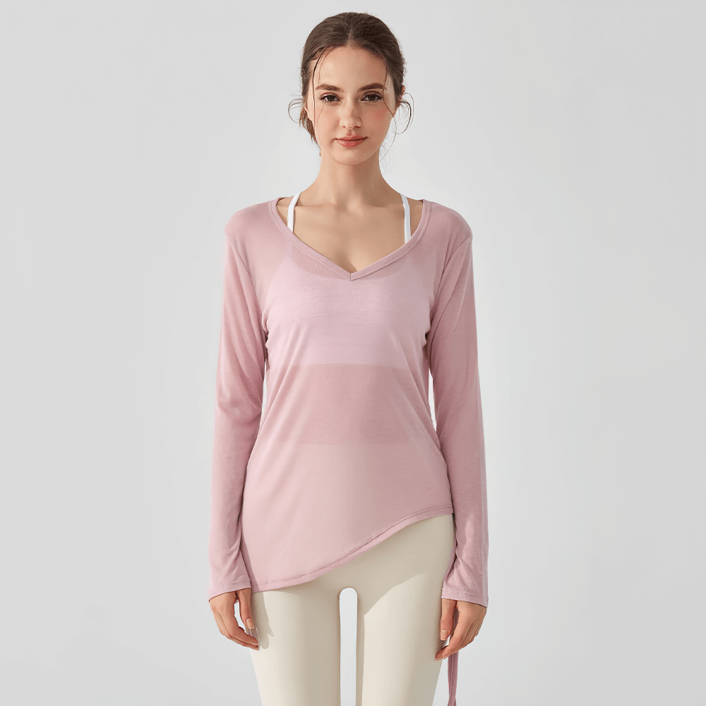 Long-sleeve yoga top with V-neck and ruched side-tie detail, perfect for activewear and training, shown in pink.