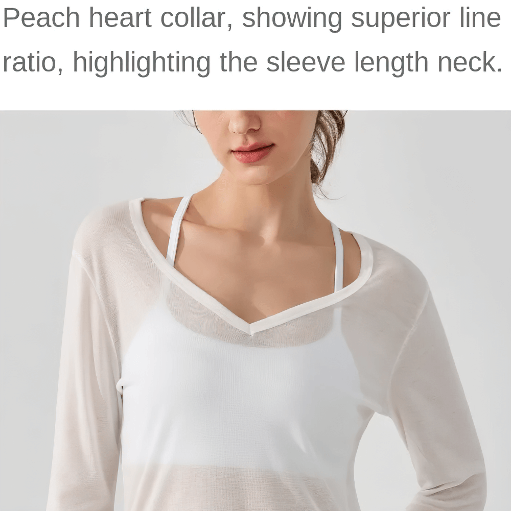 Woman wearing a sheer white top with peach heart collar and underlayer, highlighting the neck and sleeve design.