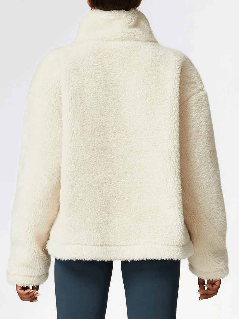 Back view of a white long sleeved outdoor lamb fleece jacket with loose fit, made from 100% polyester. Ideal for yoga and outdoor activities.