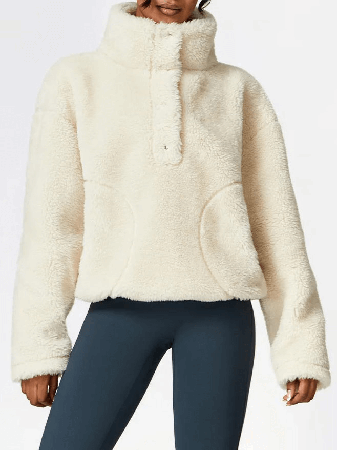 Woman wearing a long sleeved outdoor loose fitting lamb fleece jacket SF1837, perfect for yoga and outdoor activities.