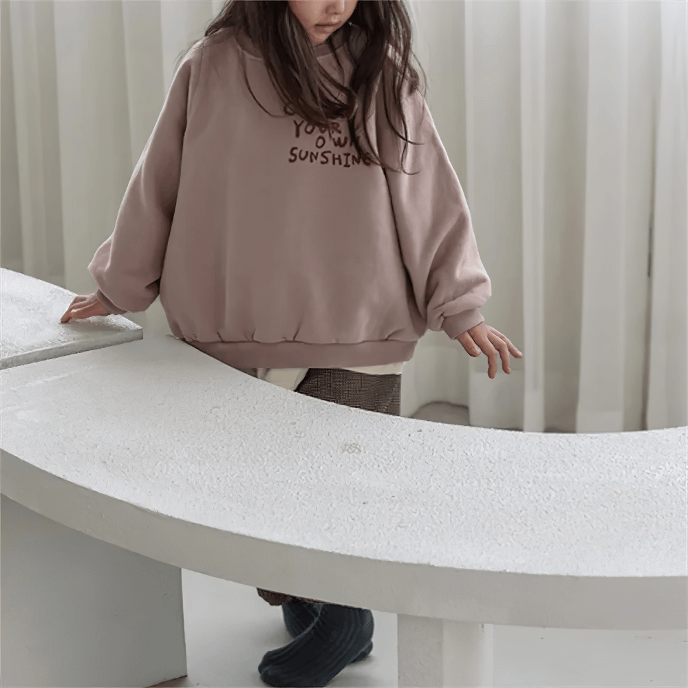 Child modeling Long-Sleeved Sweatshirt With Letter Print - SF3555, a cozy fleece with 'Create Your Own Sunshine' message.