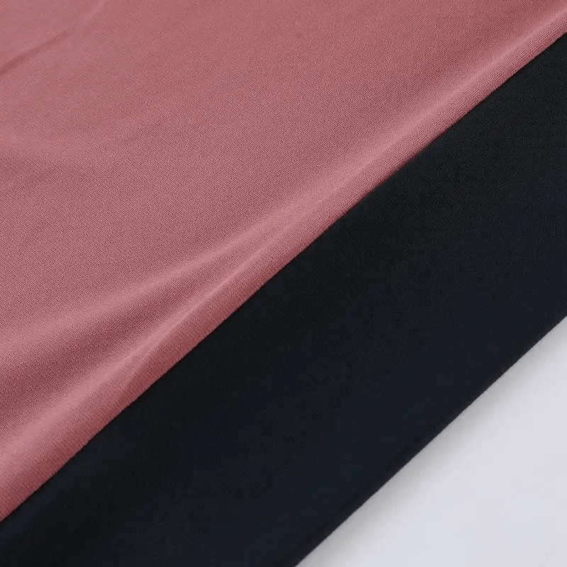 Close-up of orange and black fabric from the Long Sleeves Double Color Running Pullover SF2074, showcasing its vibrant two-tone design.