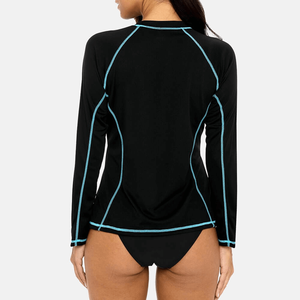 Women's long sleeves surf top UPF 50+ beachwear in black with blue accents, perfect for sun protection and swimming.