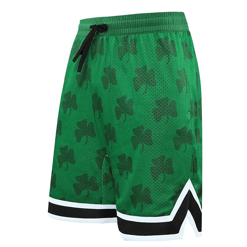 Green breathable basketball shorts with shamrock print and black drawstring, featuring quick-dry material and convenient side pockets.